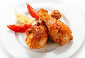 Roasted chicken drumsticks and vegetables