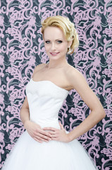 Blonde bride posing with smile