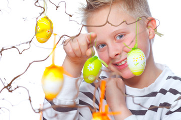 boy decorating easter bunch