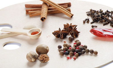 spices on a wooden palette isolated on white