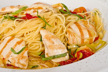 close-up of plate of pasta and chicken