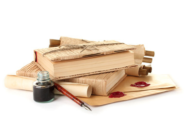 old books, ink pen and ink bottle isolated on white