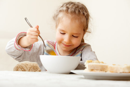 Little Girl Eating Soup