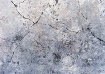 grunge damaged concrete wall surface in gray , beige and blue