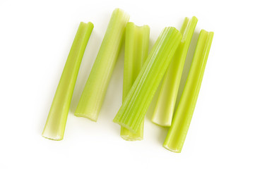 green celery sticks on white background