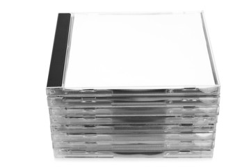 Stack of CD discs in boxes on white background