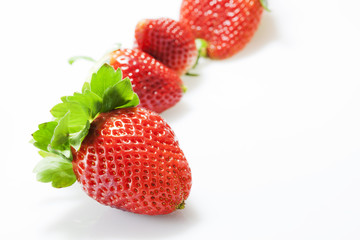 Fresh strawberries on white