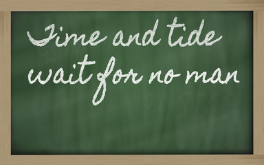 expression -  Time and tide wait for no man - written on a schoo