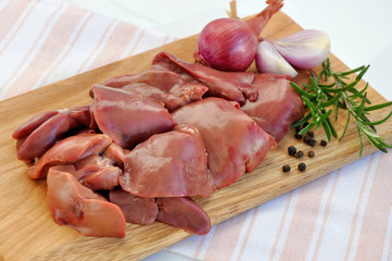Raw liver on wooden board