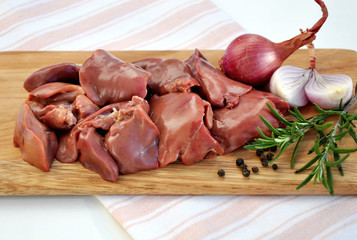 Raw liver on wooden board