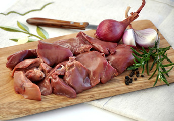 Raw liver on wooden board