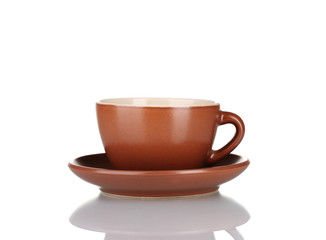 Brown cup and saucer isolated on white