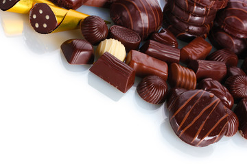 Many different chocolate candy isolated on white