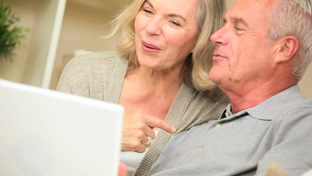 Senior Couple Using Laptop for Online Web Chat