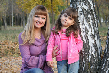 Mum and  daughter in park.