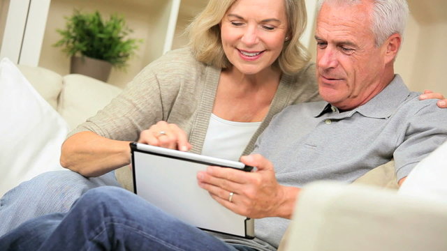 Senior Couple at Home with a Wireless Tablet