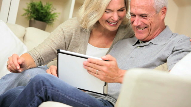 Mature Couple Having Fun with a Wireless Tablet