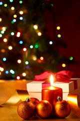 Abstract background with a New Year's present and candles