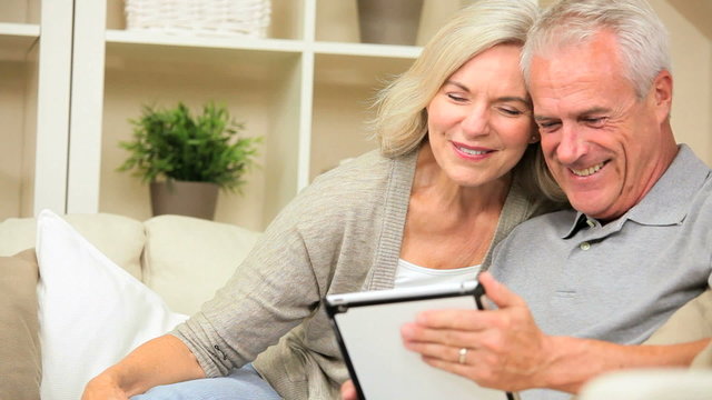 Retired Caucasian Couple Using a Wireless Tablet