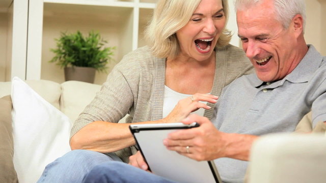 Senior Couple Having Success Online