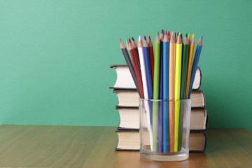 books and pencils on the desk