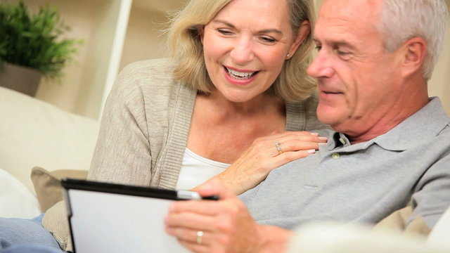 Excited Senior Couple Having Success Online