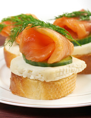 Canapes with smoked salmon  cheese and cucumber