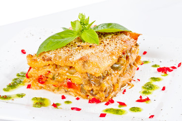 Closeup of lasagna and basil fork