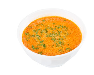 a plate of soup on a white background