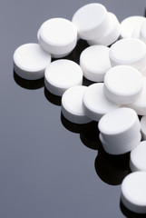 Close-up of medical capsules isolated on black  background