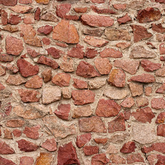 Seamless masonry wall with irregular shaped stones