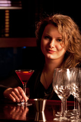 Beautiful woman at the cocktail bar