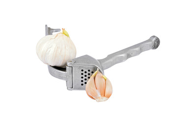 Garlic press and garlic, isolated on white background