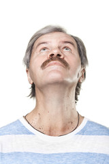 Obraz premium looking up mature caucasian man isolated on white background