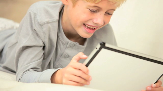 Little Boy Using Wireless Tablet