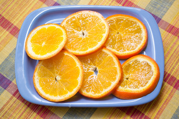 pieces of orange on the blue plate