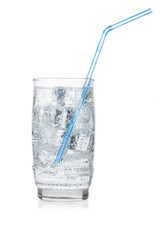 Glass of iced mineral water with straw isolated on white