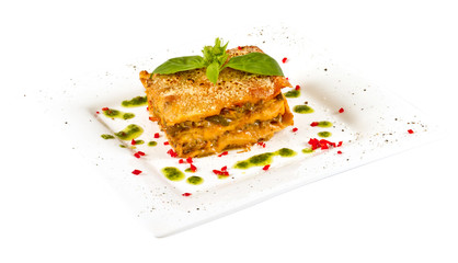 Closeup of lasagna and basil fork