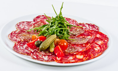 Italian sausage assorted with tomato, cucumber and ruccola