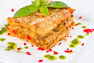 Closeup of lasagna and basil fork