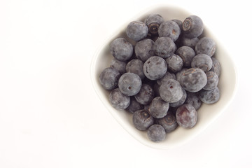 Fresh blueberries on white