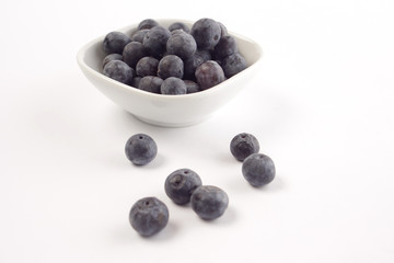 Fresh blueberries on white