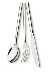 Spoon, fork and a knife lie on a plate
