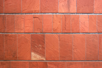 close up of terracotta tiling stone wall