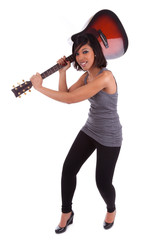 Young black woman breaking a guitar