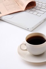 Obraz na płótnie Canvas coffee cup near the laptop .