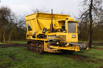 Big yellow machine - used for laying drainage stone