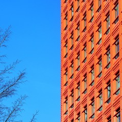 Hot orange building against bright blue sky