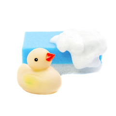 A rubber ducky and cyan  bath sponge