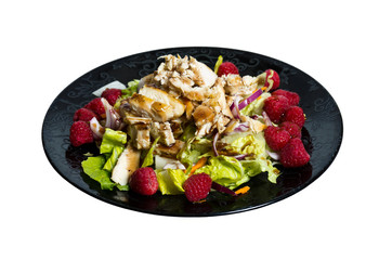 Raspberry chicken salad on black plate